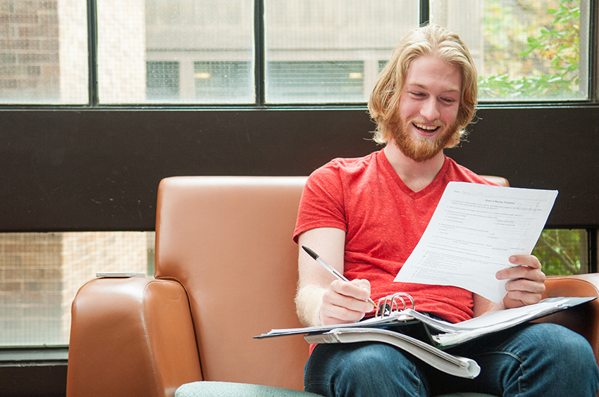 Excited Student Reading Paperwork